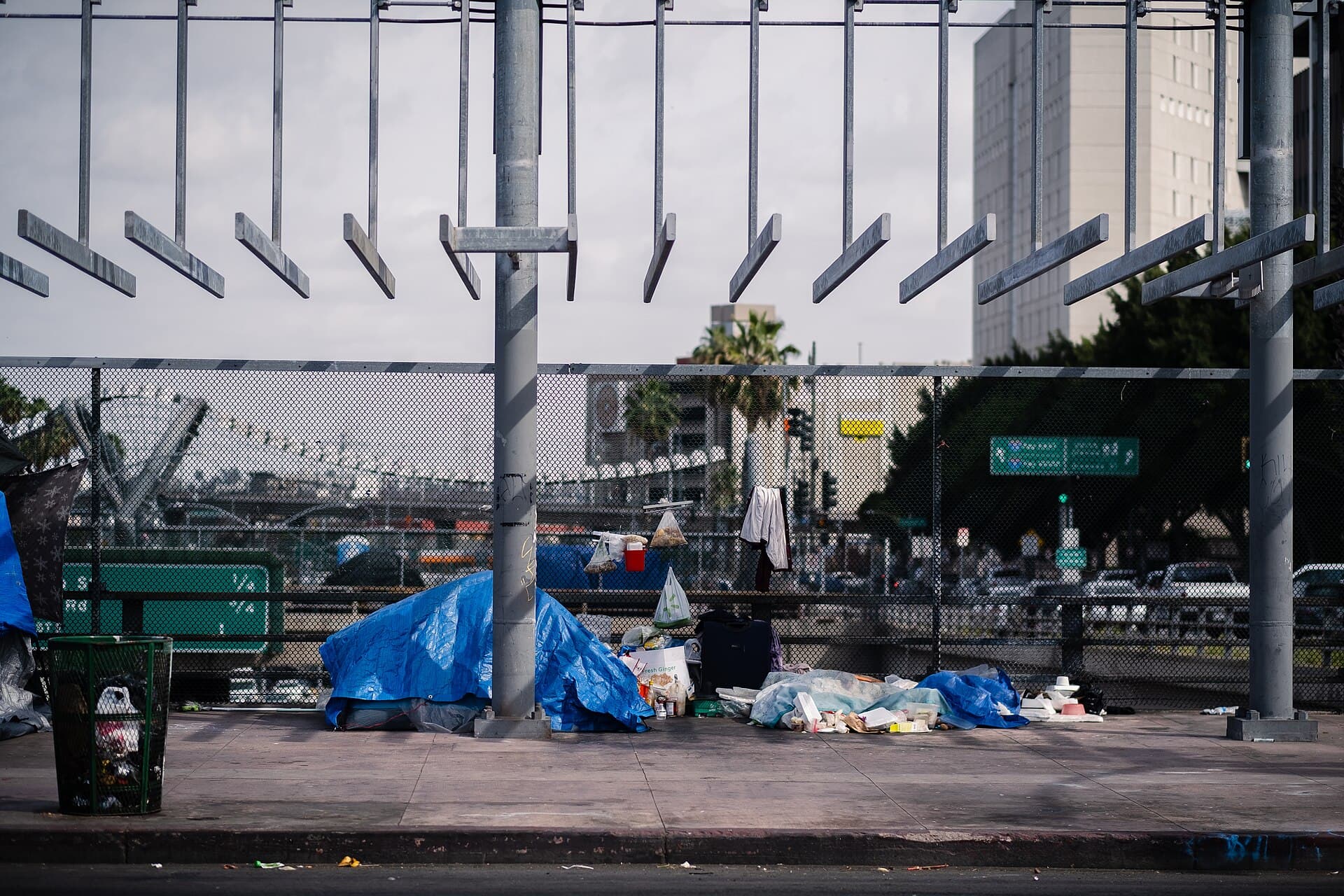 Tents and belongings along a sidewalk on a bridge over the freeway in downtown Los Angeles, April 14, 2021 (file photo)