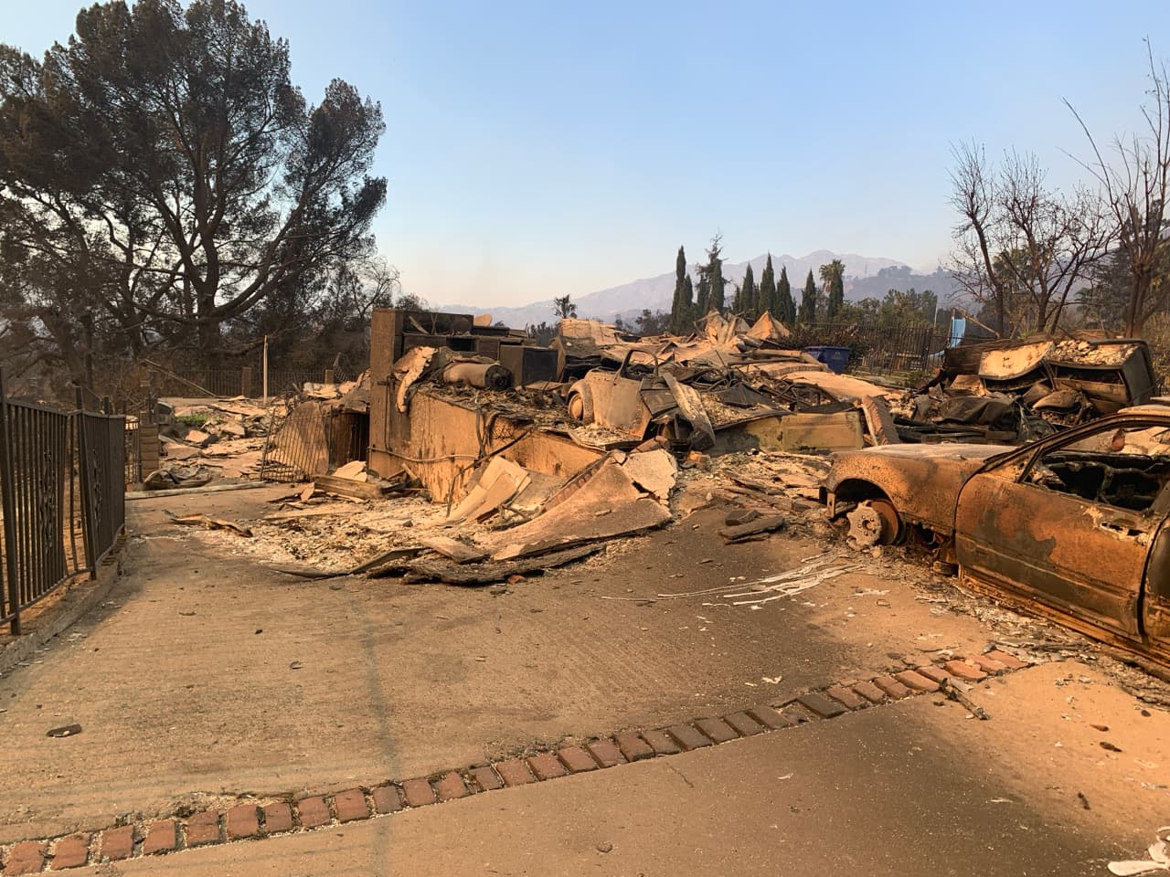A home and vehicle destroyed by the Eaton Fire in northern Altadena, January 2025 (CAL FIRE damage-inspection file photo)