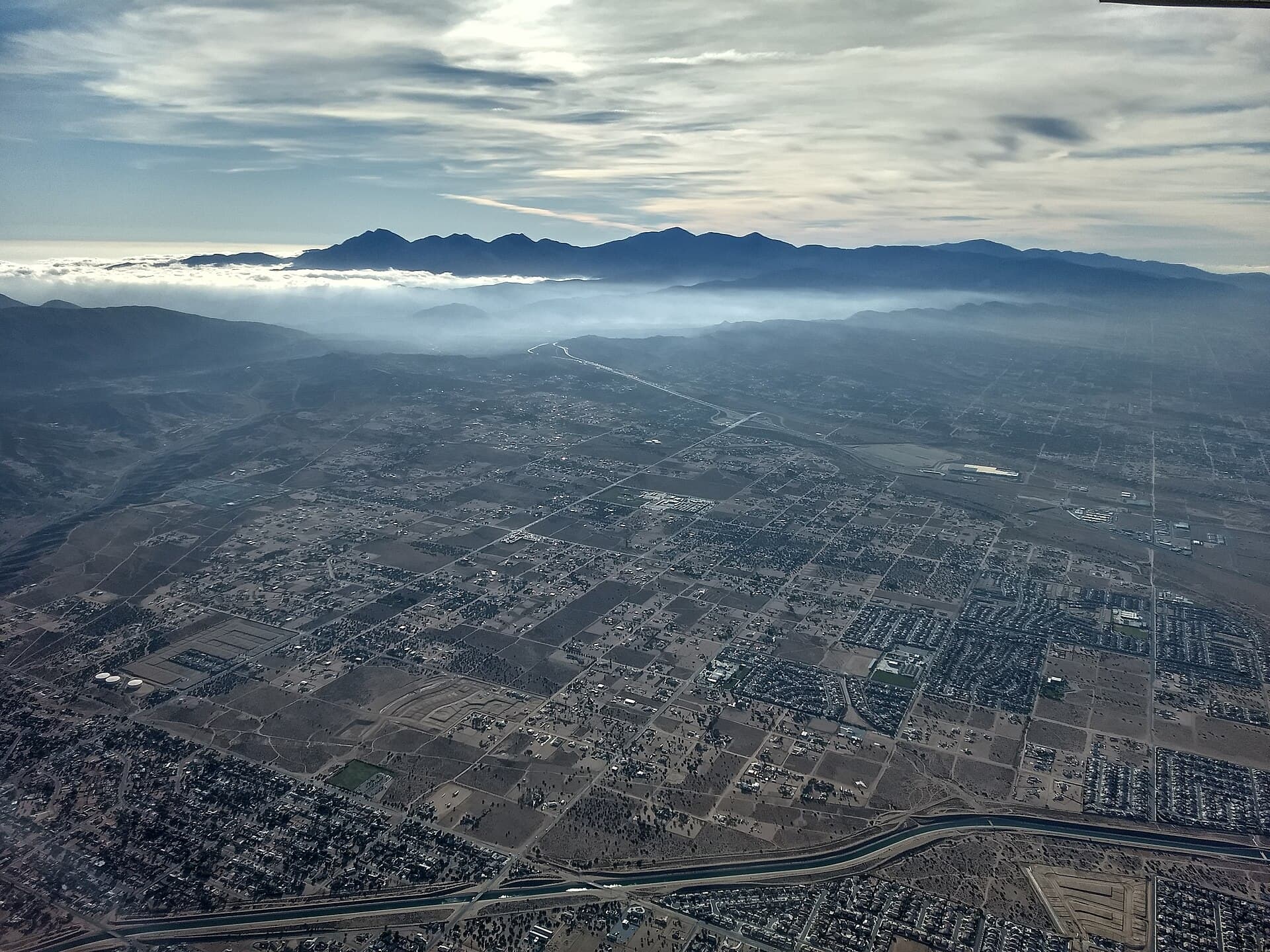 Hesperia in San Bernardino County's High Desert, seen from the air with the California Aqueduct in the foreground, Oct. 24, 2021 (file photo)
