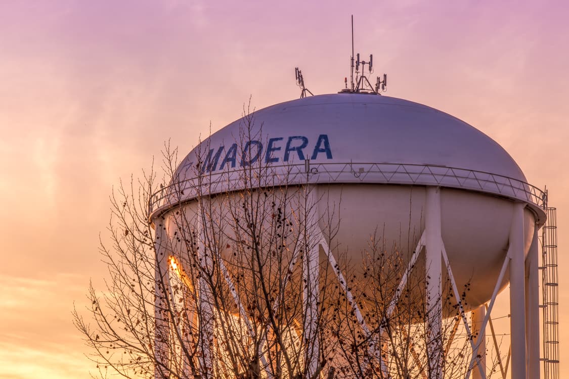 The City of Madera water tower at sunset