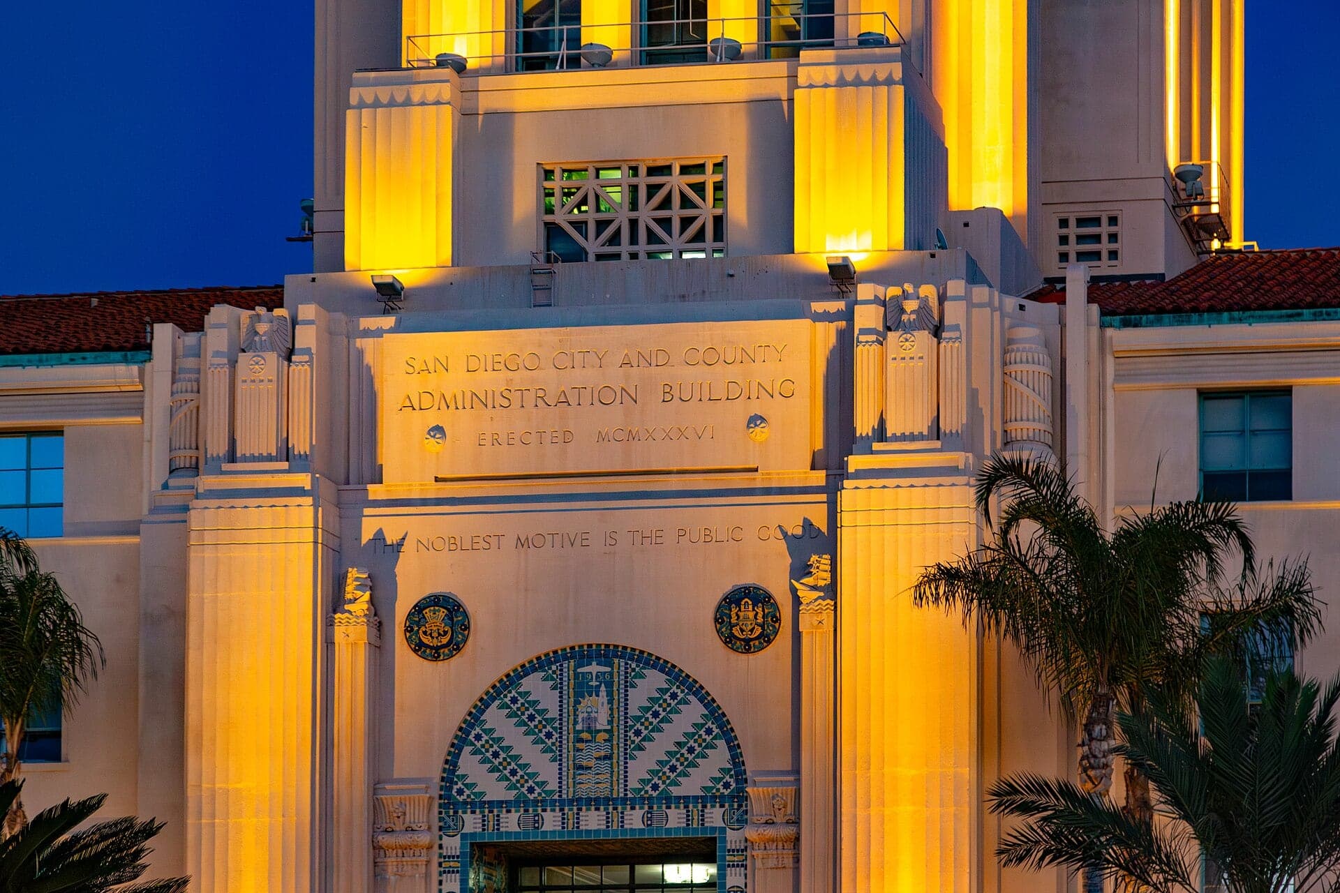 The tower and entrance of the San Diego City and County Administration Building on the harbor, lit at dusk