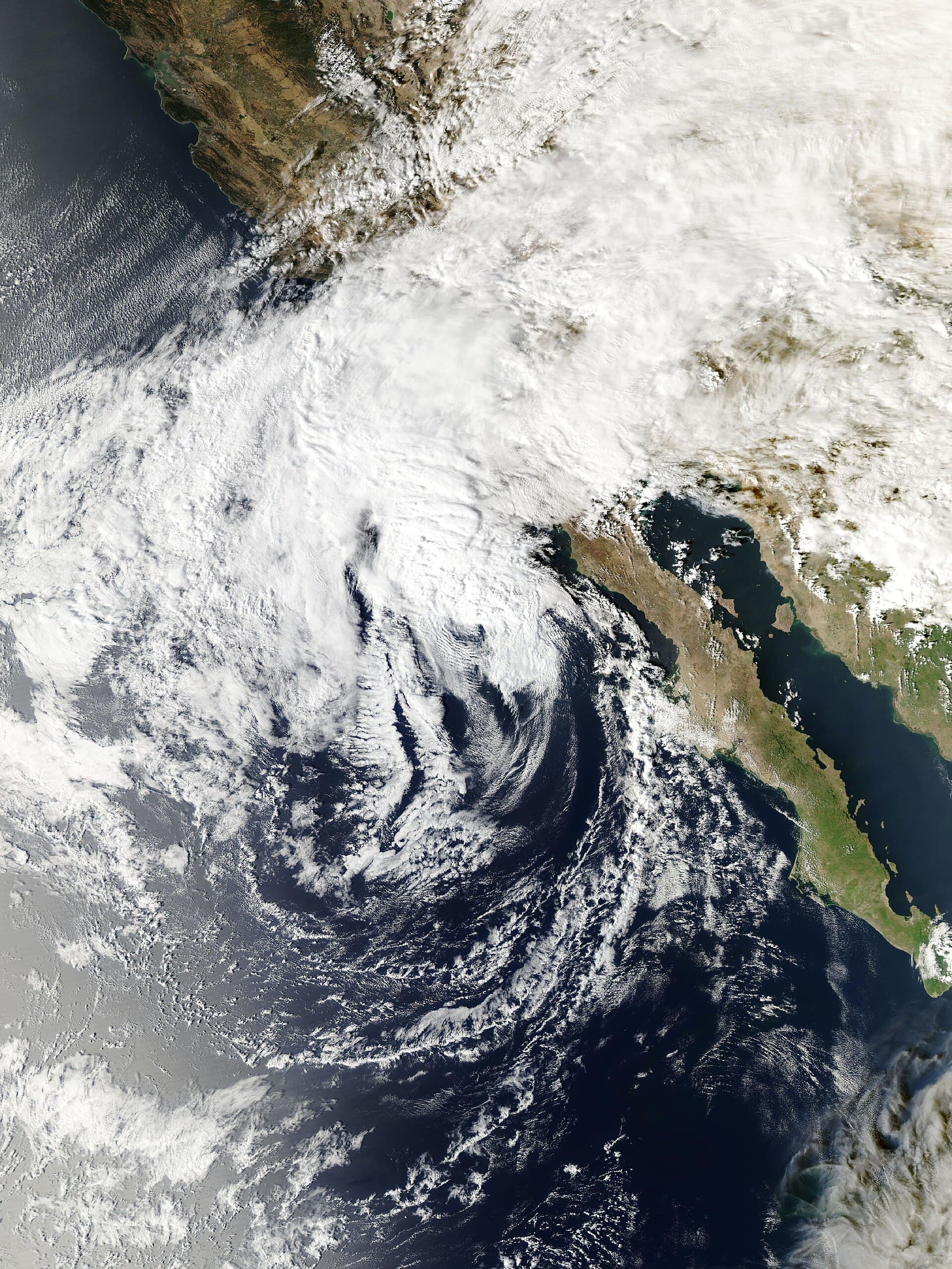 Satellite view from NASA's Aqua satellite of Tropical Storm Rachel off northern Baja California on Oct. 10, 2026, with its cloud shield spreading over Southern California