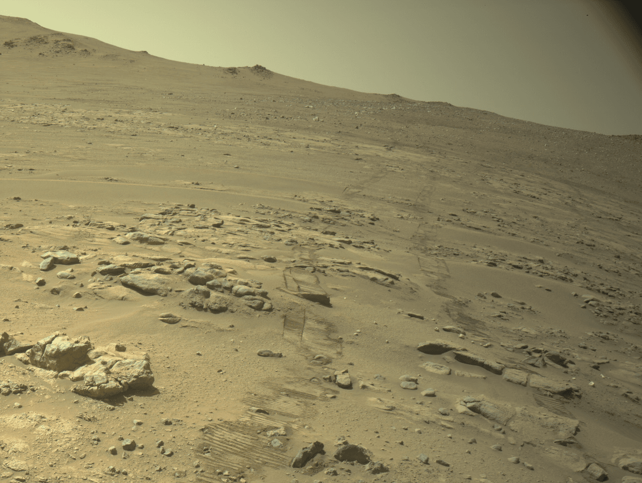 Perseverance navigation-camera view of rover tracks on Mars from the Oct. 11, 2026, drive that pushed the rover past Opportunity's total distance record (PIA26812).