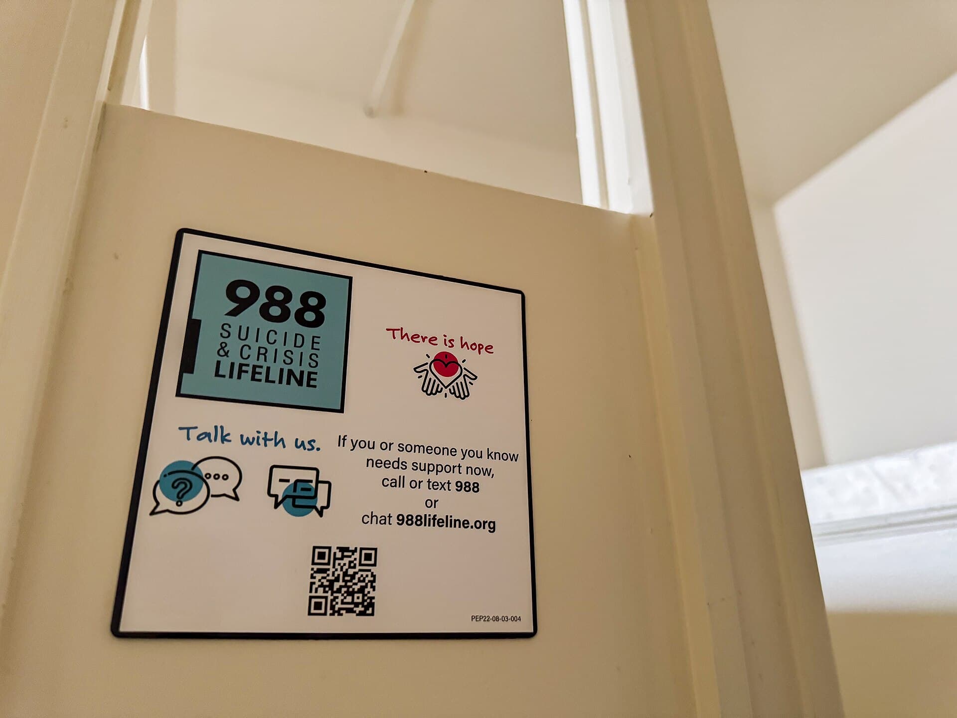 A sign promoting the 988 Suicide & Crisis Lifeline (file photo, May 2024)