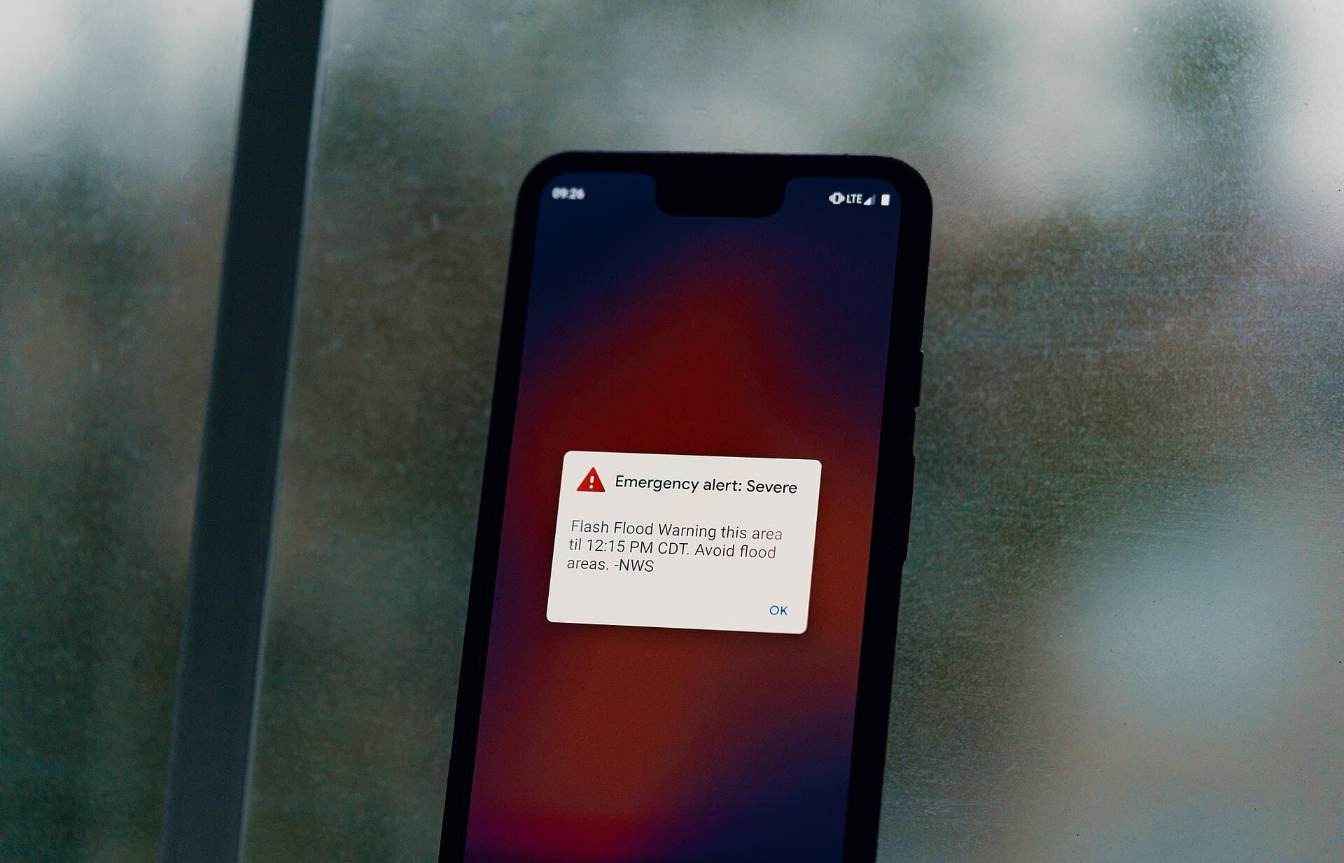 A Wireless Emergency Alert for a flash flood warning on a cellphone screen (file photo, 2019)