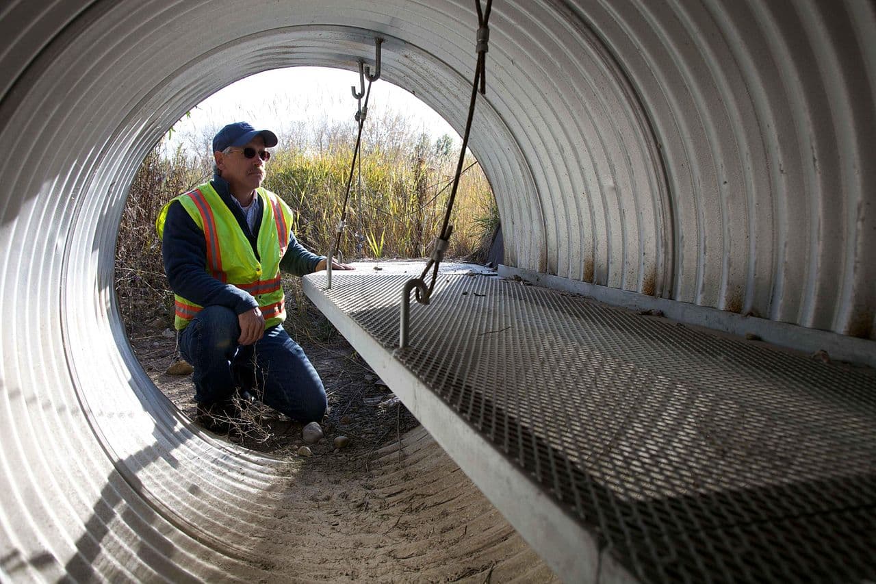 A worker inspecting a construction site