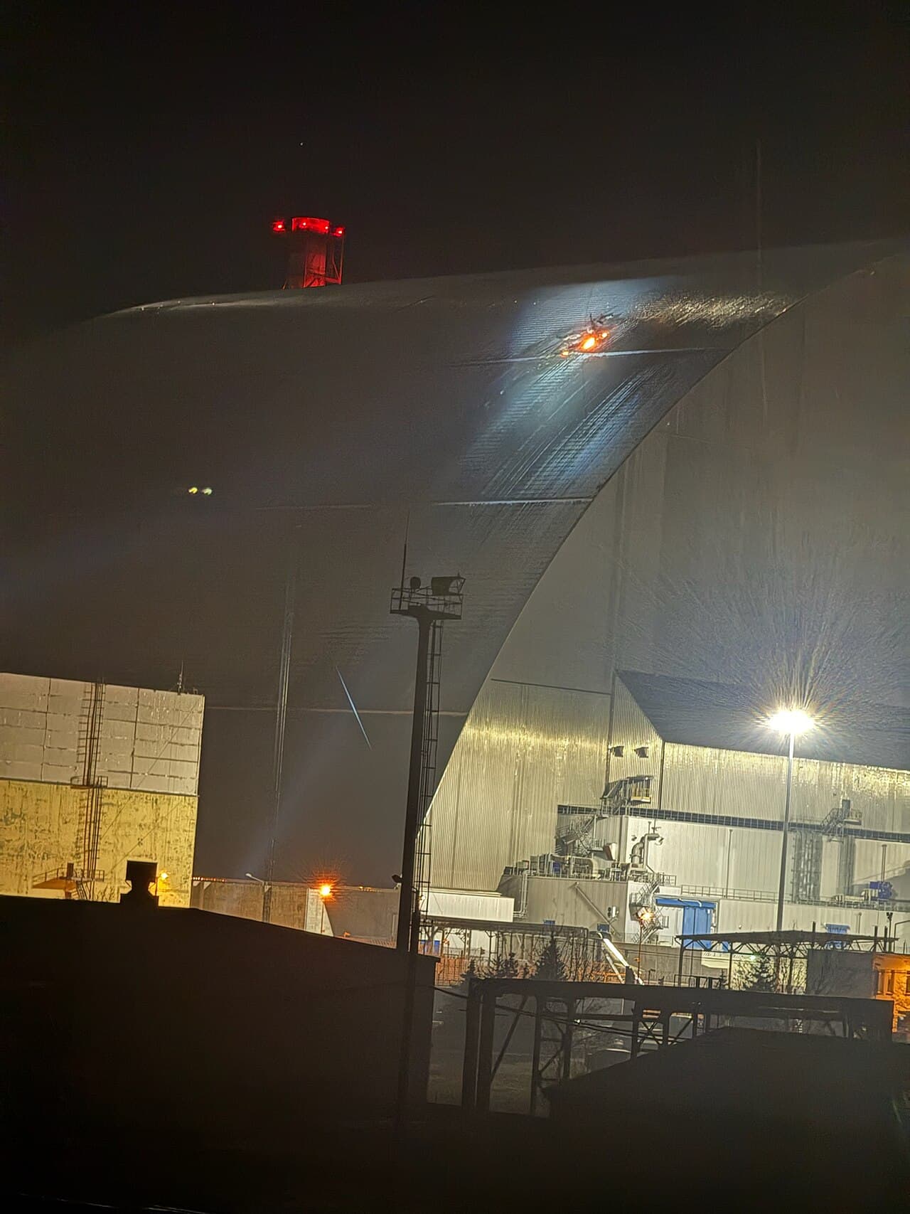 Fire and damage on the New Safe Confinement arch over the Chornobyl nuclear plant after a drone strike